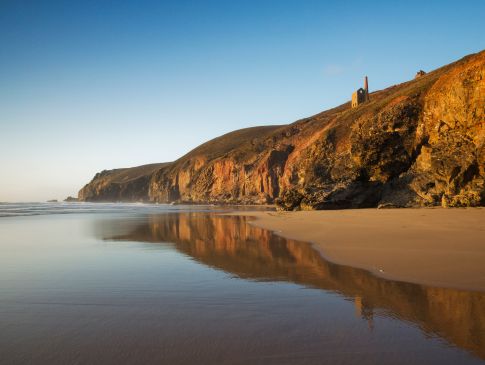 A Cornish mine, perched on the cliffs above the sea.