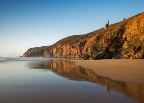 A Cornish mine, perched on the cliffs above the sea.