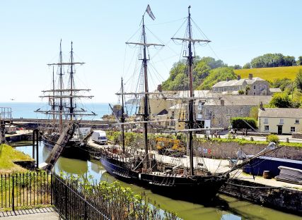 Tall ships anchored at Charlestown Harbour in Cornwall.