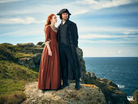 Captain Ross Poldark and Demelza stood on a Cornish cliff top