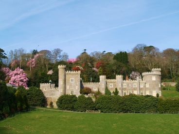 Caerhays Castle in Cornwall, surrounded by gardens.