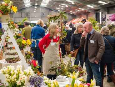 People browsing and talking at Cornwall Garden Society Spring Flower Show