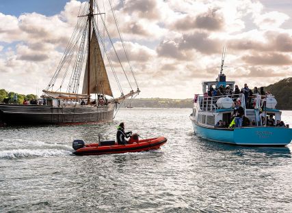 A ship, a ferry and a RIB on the River Fal.