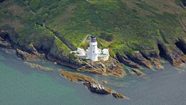 An aerial photo of St Anthony head and lighthouse, Falmouth.