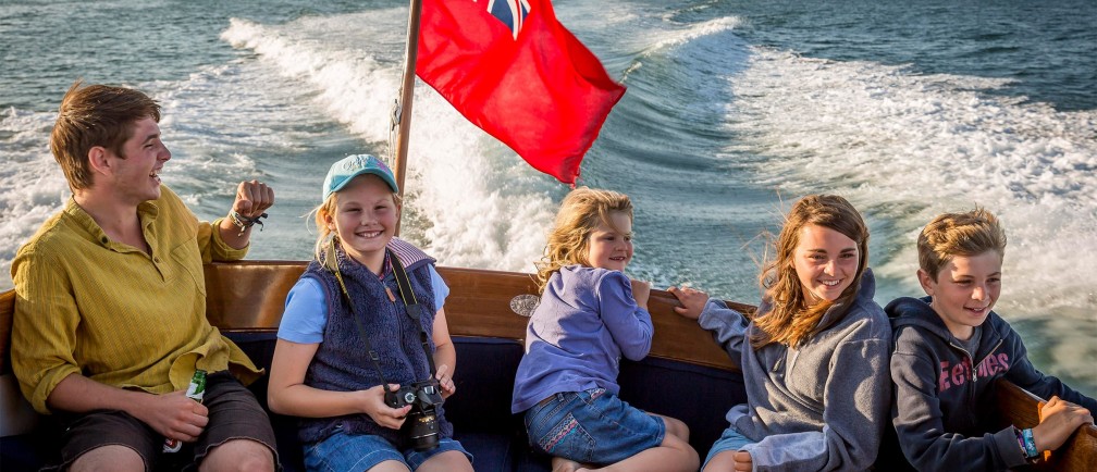 A family enjoying a boat trip.