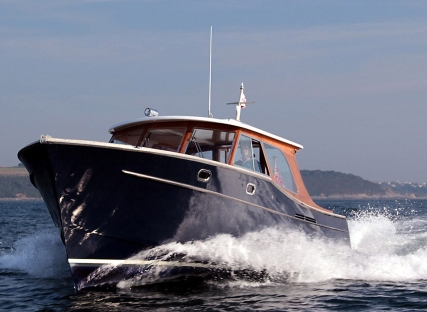 The Nare hotel's motor launch, sailing along the River Fal.