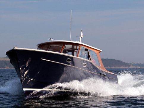 The Nare hotel's motor launch, sailing along the River Fal.