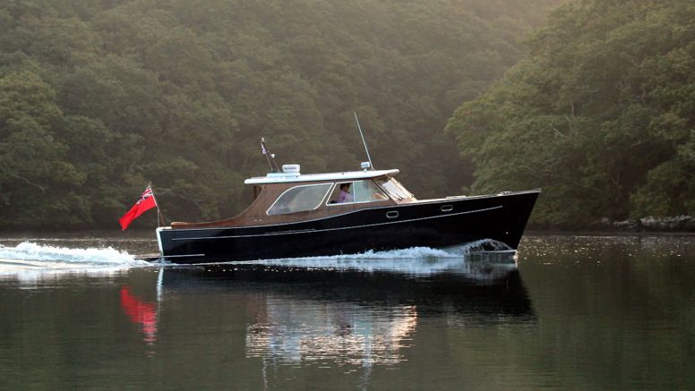 Alice Rose, The Nare's motor launch, sails the River Fal.