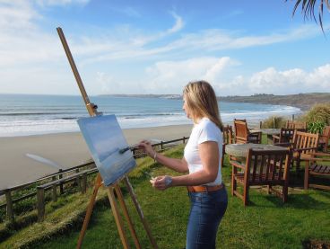 The hotel's Artist-in-Residence painting the sea view from the hotel gardens