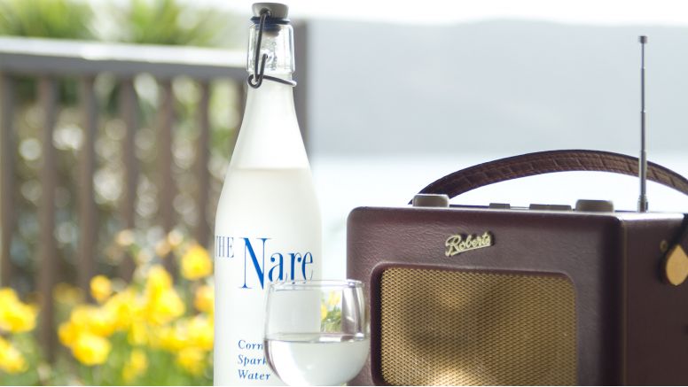 A bottle of water and a radio at The Nare hotel.