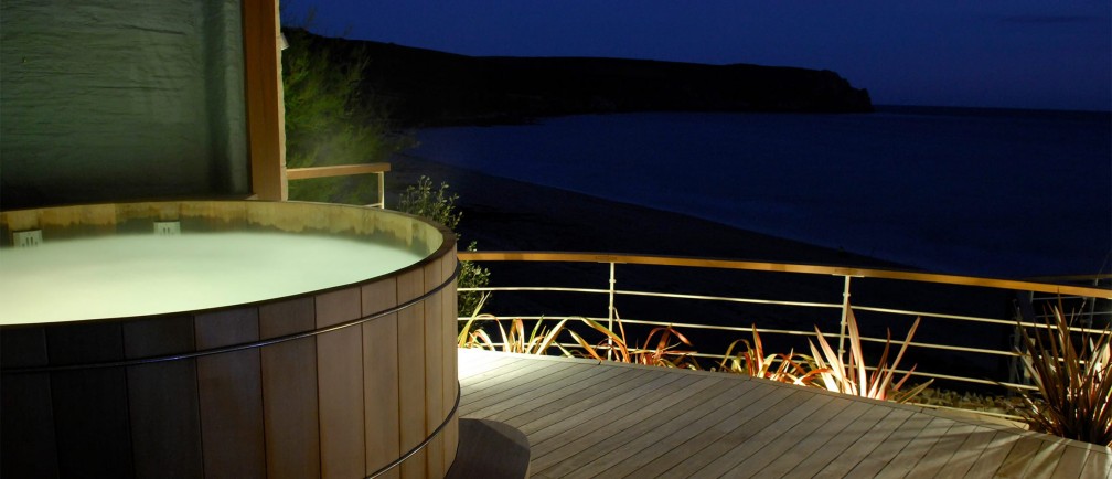 The Nare hotel's hot tub at night.