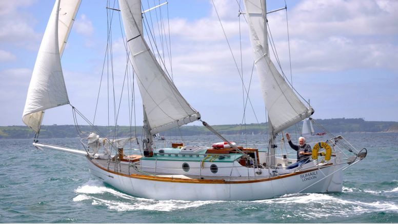 Sir Robin aboard Suhaili in Falmouth harbour at the 50th anniversary of his departure in the 1968 Golden Globe Race.