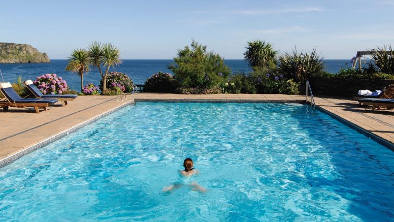 Someone swims in The Nare's outdoor pool.