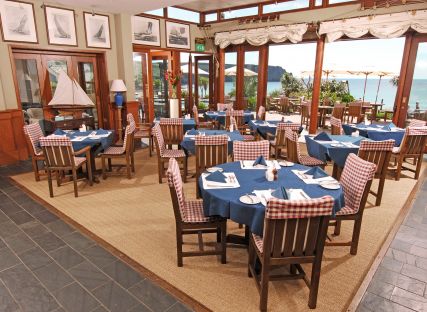 Tables set for service at The Quarterdeck restaurant in Cornwall.