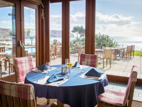 The sea view from inside The Quarterdeck restaurant at The Nare Hotel