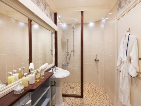 A bathroom at The Nare hotel, with a walk-in shower.