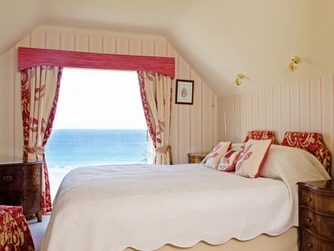 The sea view from the bedroom of Lemoria, a luxury cottage by the sea in Cornwall.