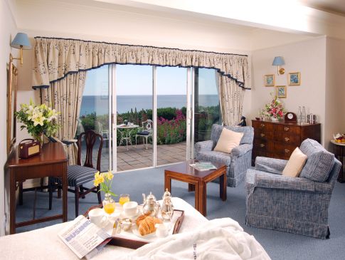 A room at The Nare hotel, with a view of the sea.