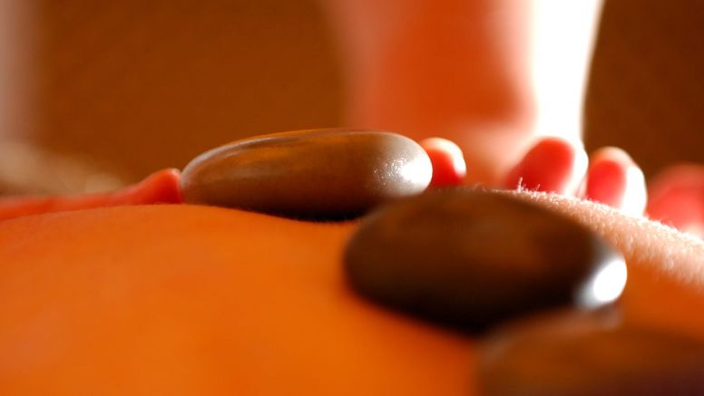 A hot-stone massage treatment.