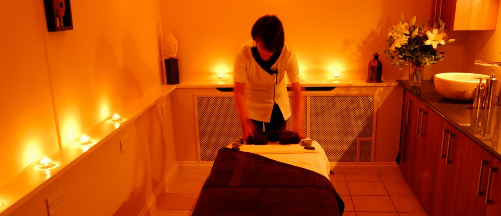 A therapist readies a massage table at Carne Bay Spa in Cornwall.