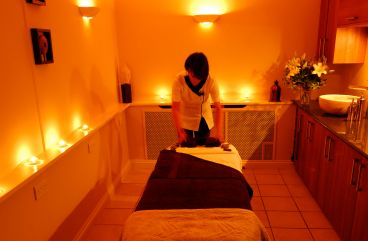 A therapist readies a massage table at Carne Bay Spa in Cornwall.