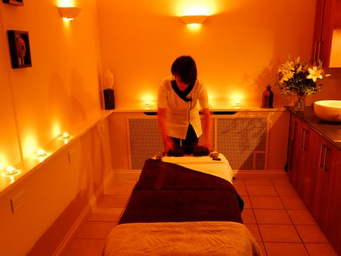 A therapist readies a massage table at Carne Bay Spa in Cornwall.