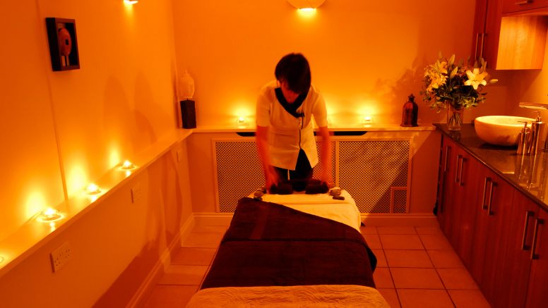 A therapist readies a massage table at Carne Bay Spa in Cornwall.