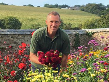 The Nare hotel's Head Gardener tending to some flowers.