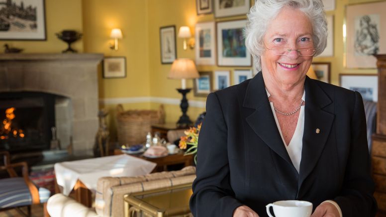 The Nare hotel's Maitre D', holding a cup of tea.