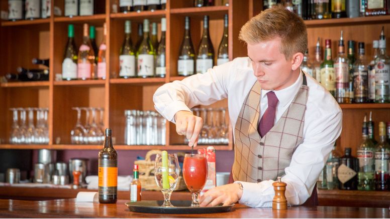 A barman stirs a cocktail at The Nare hotel.