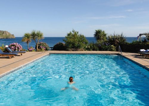 The outdoor heated swimming pool at The Nare, a luxury hotel in Cornwall.
